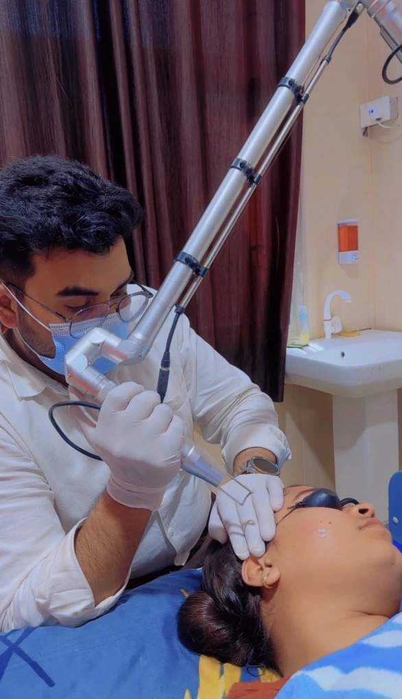 Dr Usama Siddiqui evaluating facial pigmentation
